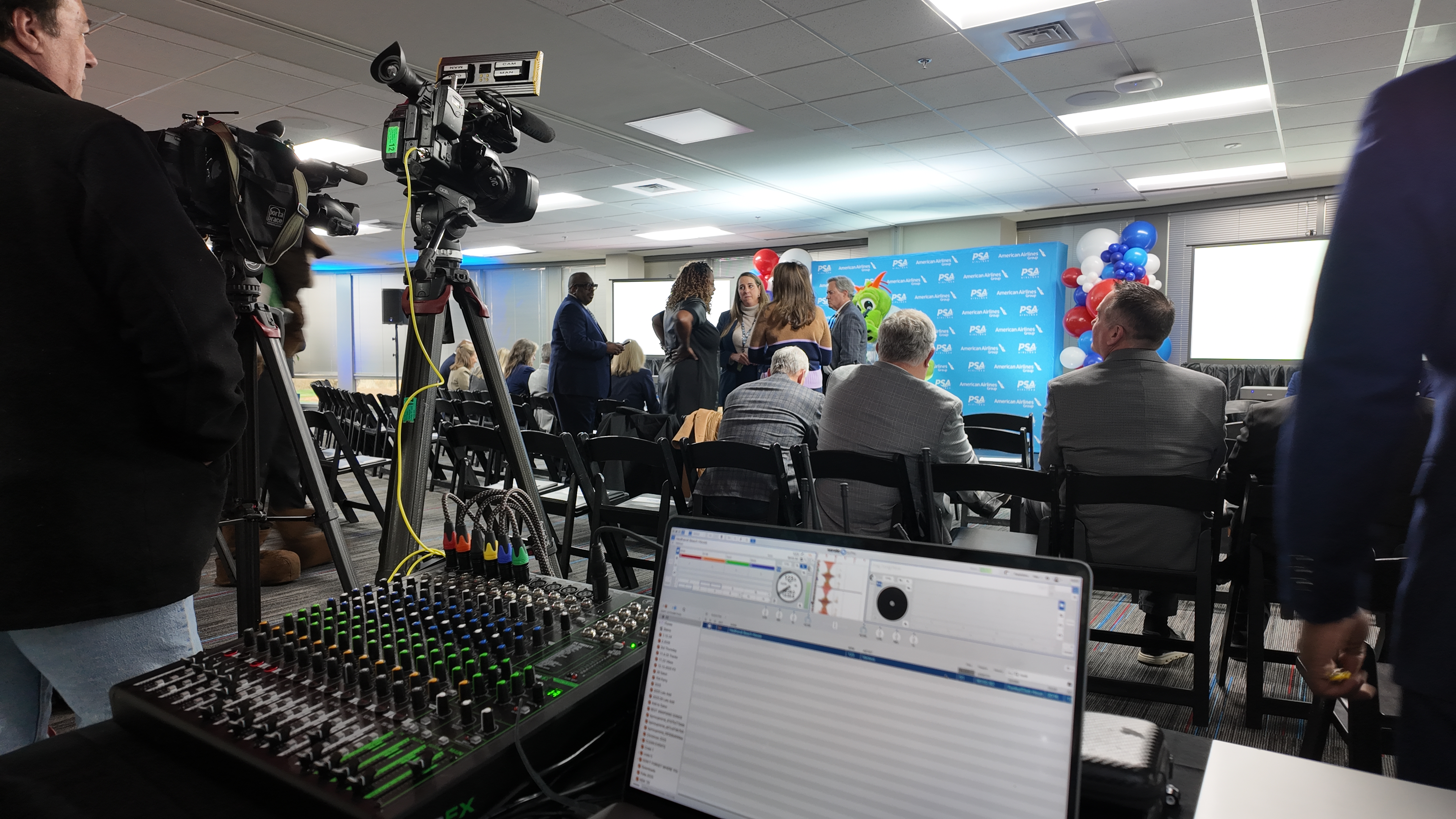 Live audio mixing board and cameras at PSA Airlines grand opening