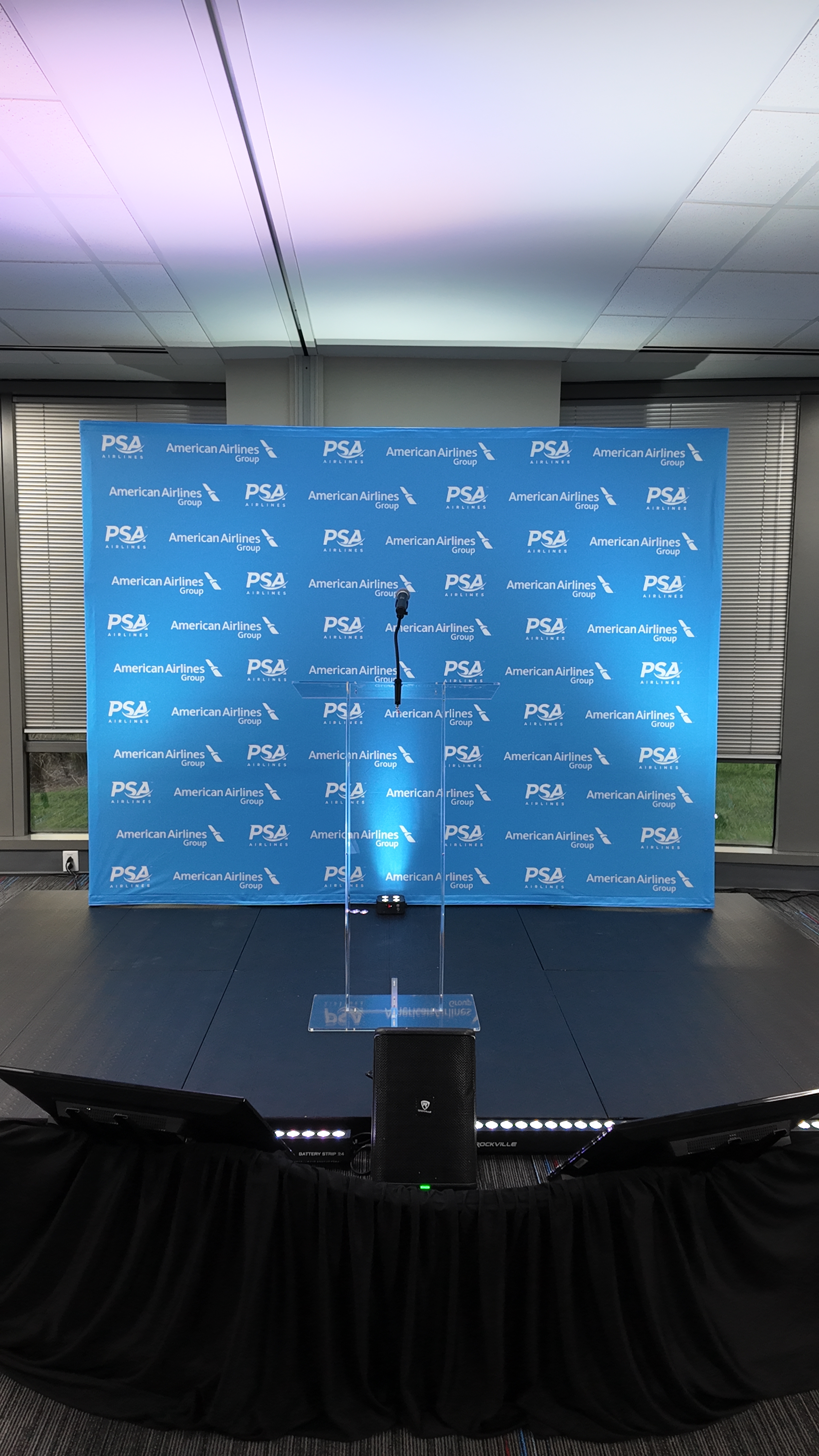 PSA Airlines branded podium on stage — Charlotte NC
